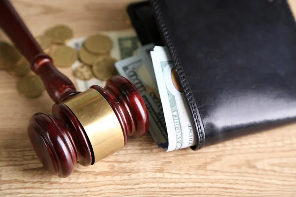 Gavel and money coins on wooden background — Stock Photo, Image