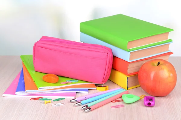 Bright school supplies on table on light background — Stock Photo, Image