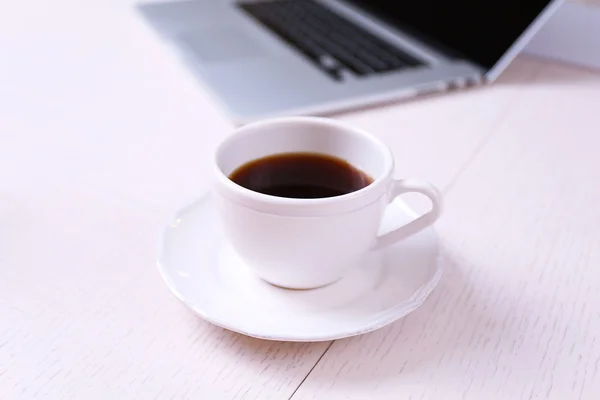 Cup of coffee at workplace — Stock Photo, Image