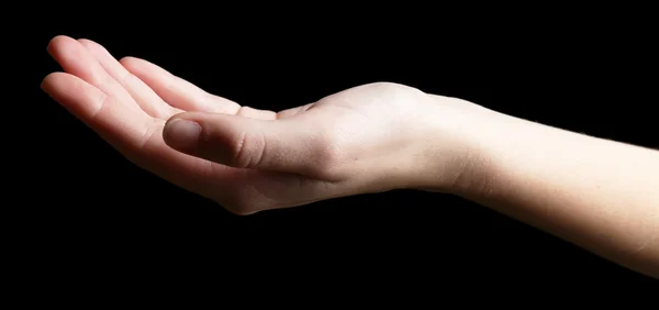 Human hand on black background — Stock Photo, Image