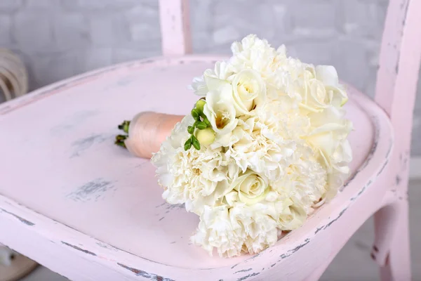 Beautiful wedding bouquet on wooden chair — Stock Photo, Image