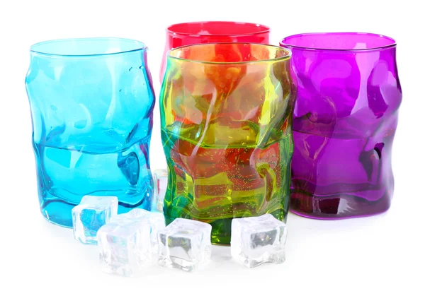 Colorful glasses and ice cubes isolated on white — Stock Photo, Image