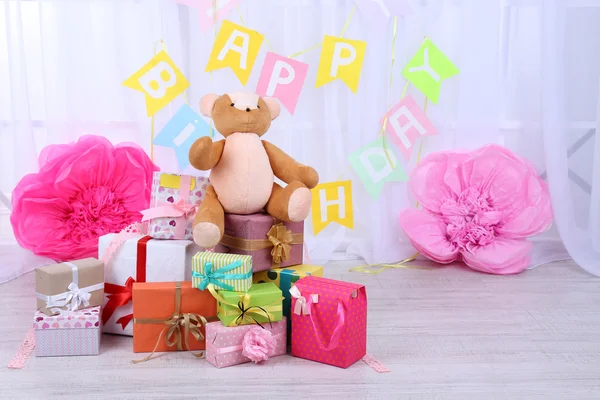 Many birthday gifts in room — Stock Photo, Image