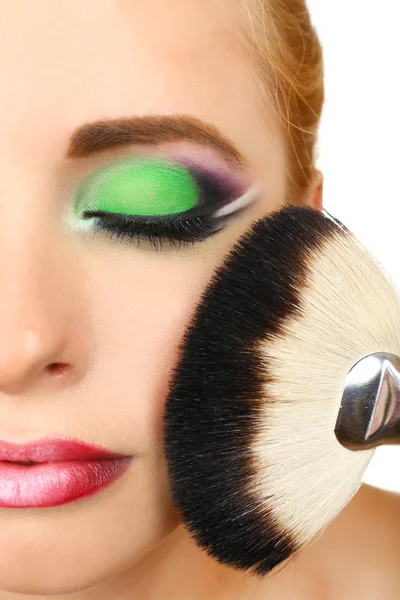 Beautiful woman with bright make-up and brush, close up — Stock Photo, Image