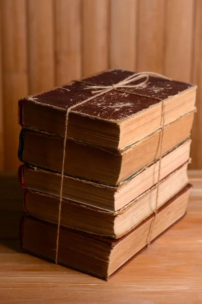 Old books on table on wooden background — Stock Photo, Image