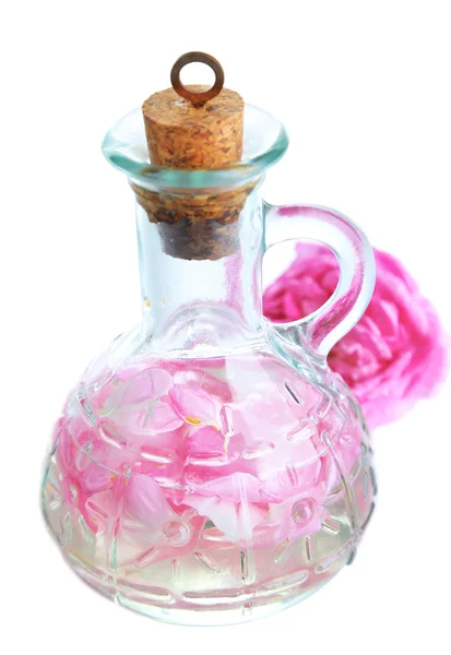 Růžového oleje v láhvi izolovaných na bílém — Stock fotografie