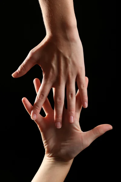 Human hands on black background — Stock Photo, Image