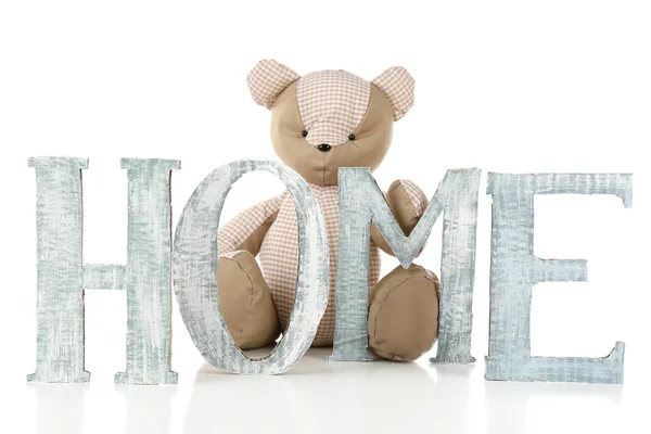 Decorative letters forming word HOME with teddy bear isolated on white — Stock Photo, Image