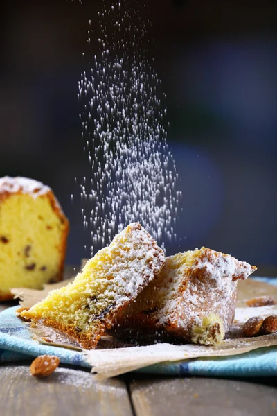 Tasty cake on table on dark background — Stock Photo, Image