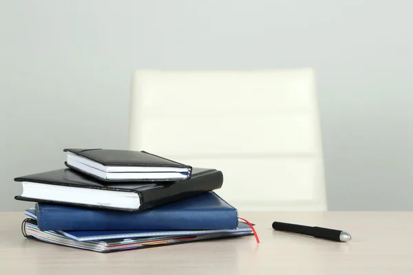 Empty workplace in office on gray background — Stock Photo, Image