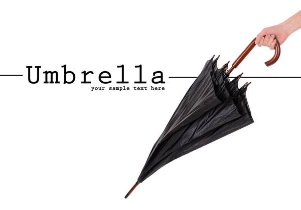 Schwarzer Regenschirm in der Hand isoliert auf weißem — Stockfoto