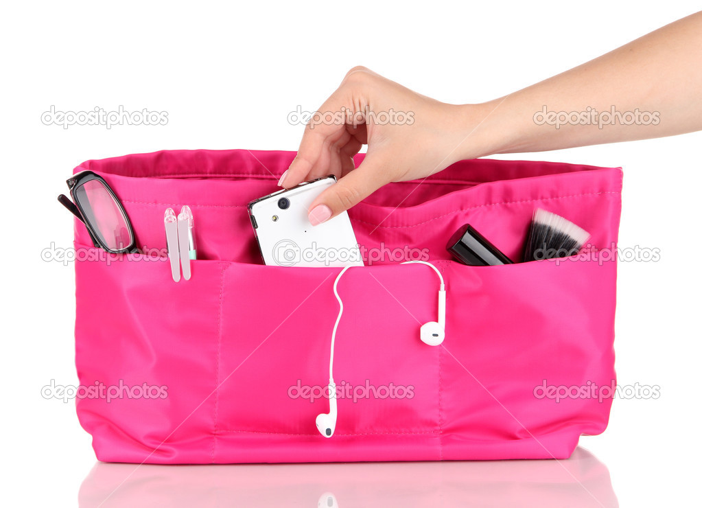 Pink cosmetic bag and female hand isolated on white