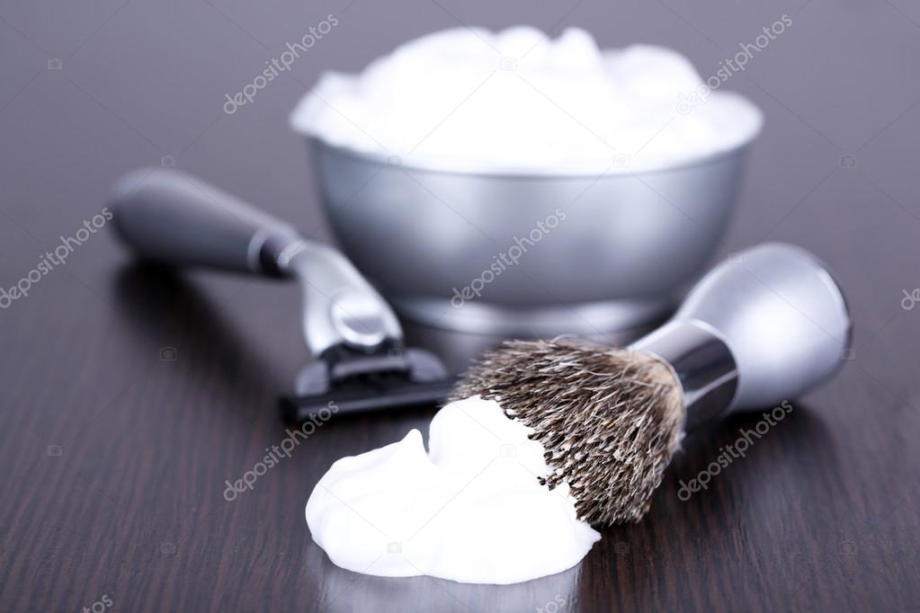 Male luxury shaving kit on wooden background