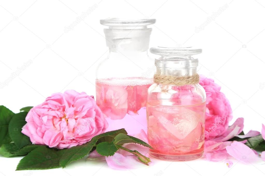 Rose oil in bottle isolated on white