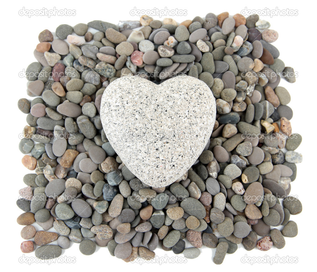 Heart on small sea stones, isolated on white