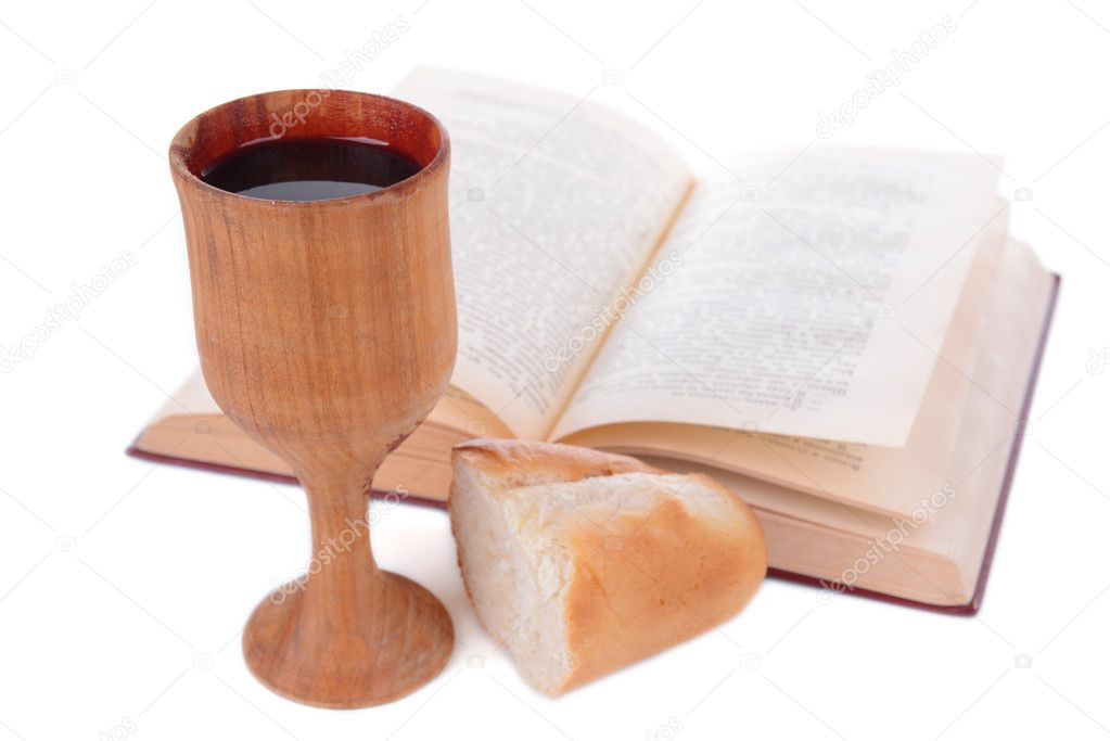 Cup of wine,bread and book isolated on white