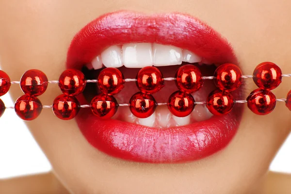 Necklace in teeth, close up — Stock Photo, Image