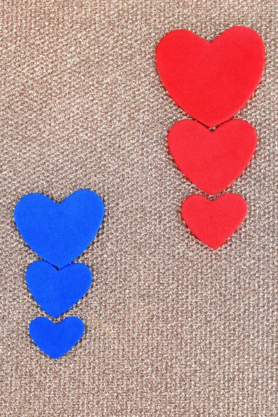 Hearts made of felt on golden background — Stock Photo, Image