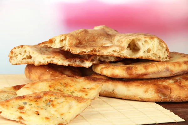 Pita breads on table on bright background — Stock Photo, Image