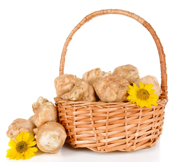 Topinambur roots in wicker basket isolated on white — Stock Photo, Image