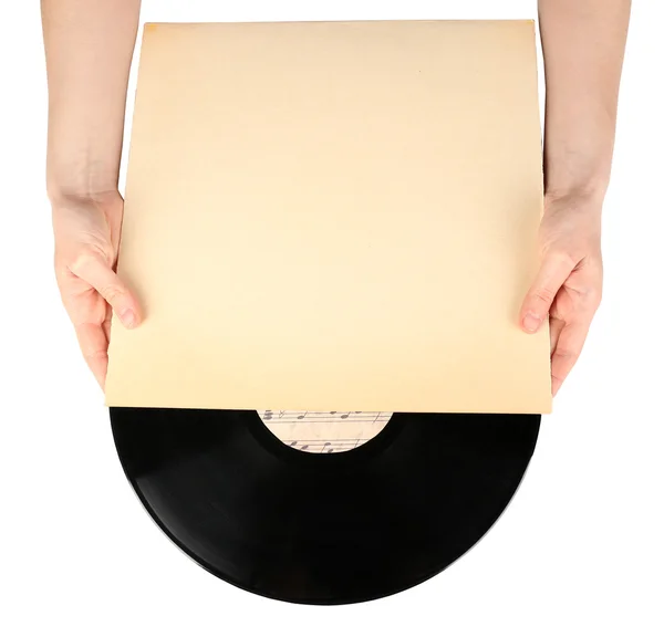 Mani che tengono vecchi dischi in vinile in astuccio di carta, isolate su bianco — Foto Stock