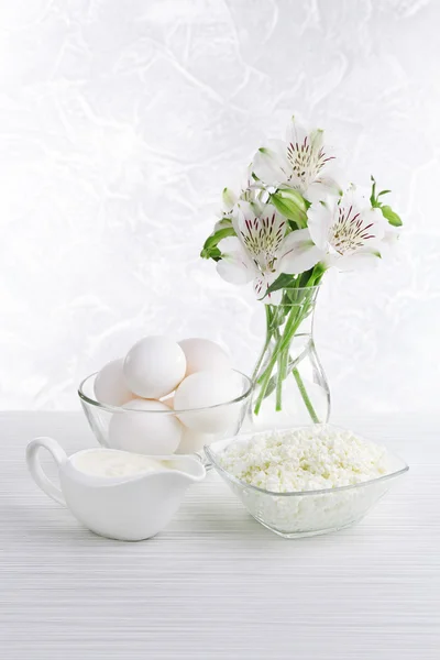 Tasty dairy products on wooden table — Stock Photo, Image