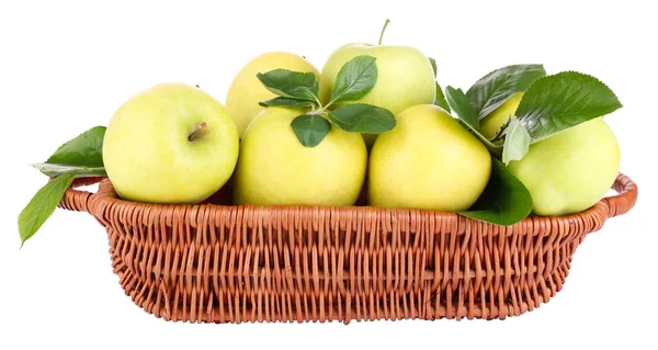 Ripe sweet apples with leaves in wicker basket, isolated on white — Stock Photo, Image