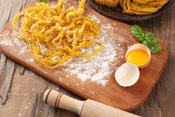 Still life with raw homemade pasta and ingredients for pasta — Stock Photo, Image