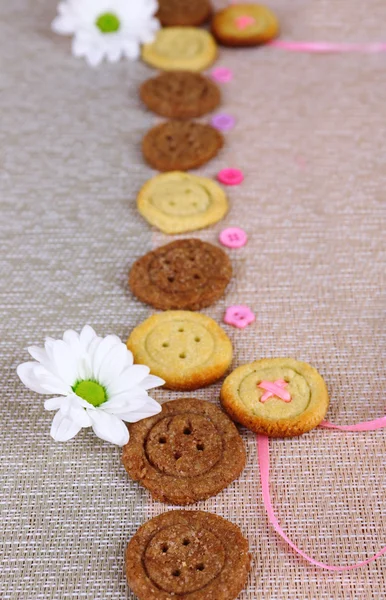 Sugar cookies in shape of buttons on table — Stock Photo, Image