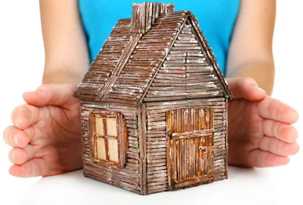 Small wooden house in hands, close up — Stock Photo, Image