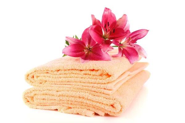 Color towels and lily flowers, isolated on white — Stock Photo, Image
