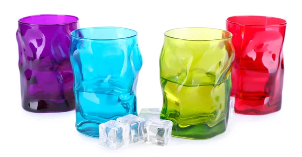 Colorful glasses and ice cubes isolated on white — Stock Photo, Image