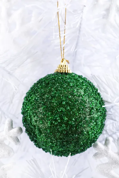 Christmas toy on snow-white Christmas tree close-up isolated on white — Stock Photo, Image