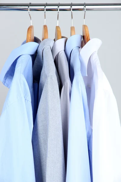 Office male clothes on hangers, on gray background — Stock Photo, Image