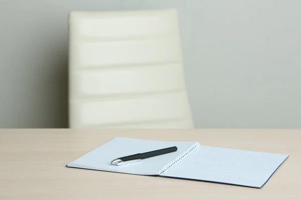 Empty workplace in office on gray background — Stock Photo, Image