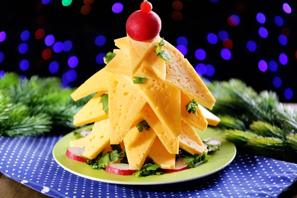 Christmas tree from cheese on table on dark background — Stock Photo, Image