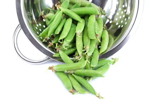 Fresh green peas in colander isolated on white background — Stock Photo, Image