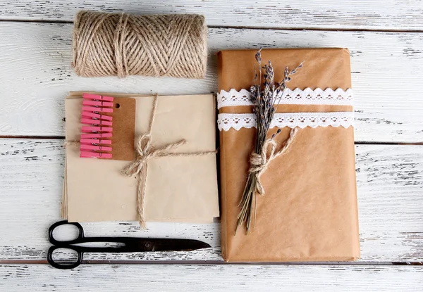 Natural style handcrafted gift box on wooden background. Concept of natural style design — Stock Photo, Image