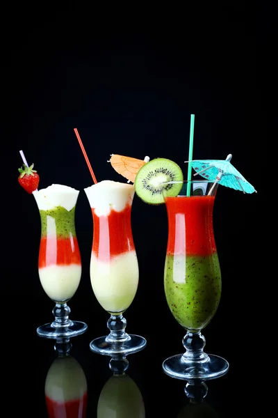 Delicious fruit smoothie on black background — Stock Photo, Image