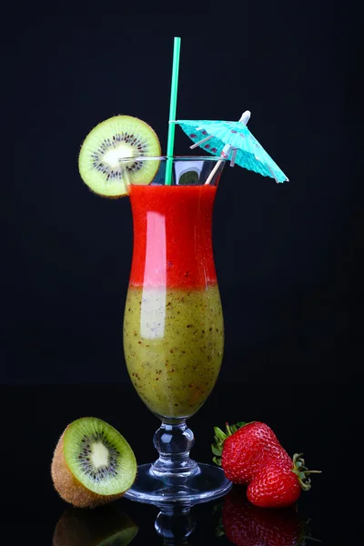 Delicious fruit smoothie on black background — Stock Photo, Image