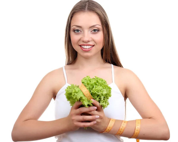 Schönes Mädchen mit Salat und Maßband — Stockfoto