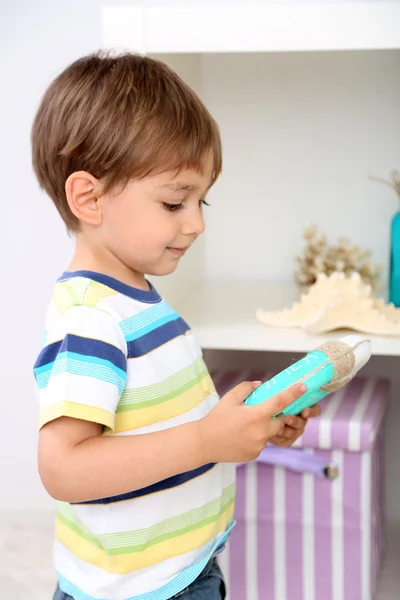 Cute little boy playing in room — Stock Photo, Image