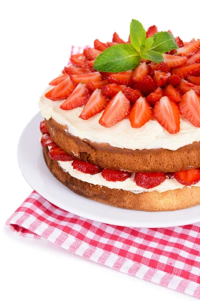 Delicious biscuit cake with strawberries isolated on white — Stock Photo, Image
