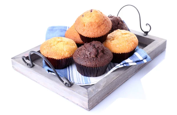 Smakelijke muffins op houten dienblad geïsoleerd op wit — Stockfoto
