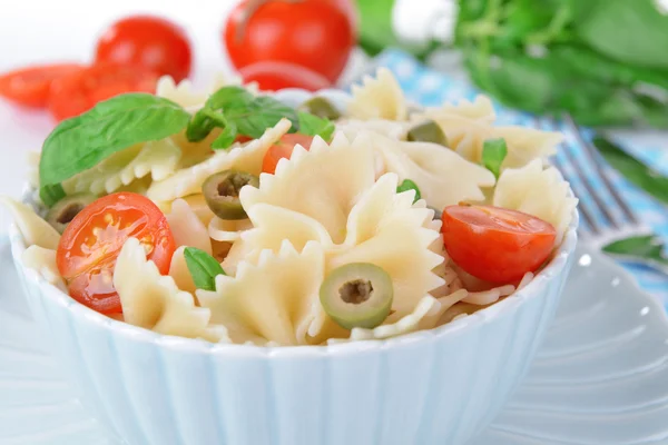 Delicious pasta with tomatoes on plate on table close-up — Stock Photo, Image