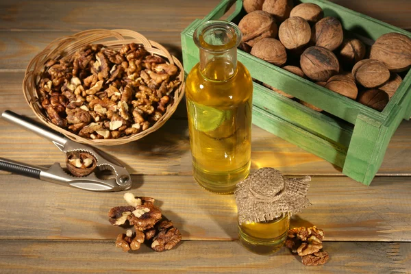 Walnut oil and nuts — Stock Photo, Image