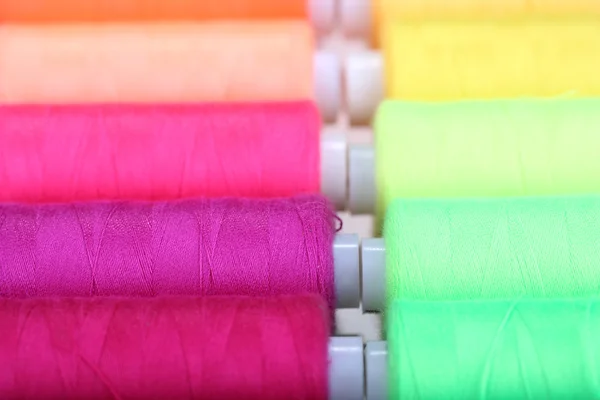 Multicolor sewing threads background — Stock Photo, Image