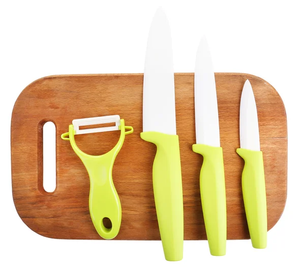 Kitchen knives and cutting board isolated on white — Stock Photo, Image