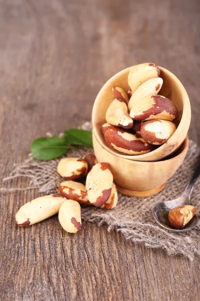 Tasty brasil nuts on wooden background — Stock Photo, Image