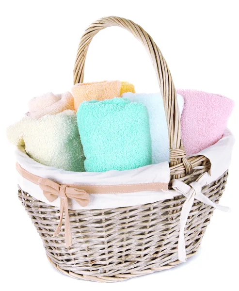 Colorful towels in basket isolated on white — Stock Photo, Image